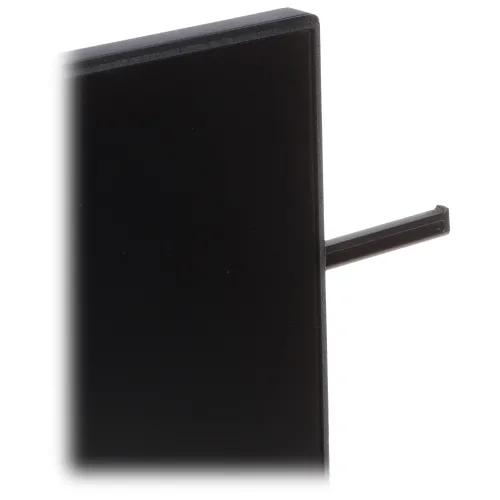 Zdjęcie przedstawia zbliżenie na róg czarnego panelu z wystającym uchwytem po prawej stronie. Krawędzie panelu są lekko zaokrąglone, a tło jest białe i rozmyte po lewej stronie.