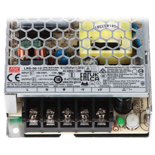 Zasilacz impulsowy z metalową obudową z otworami wentylacyjnymi, widoczny od góry z etykietą zawierającą specyfikacje techniczne. Na dole znajdują się zaciski do podłączenia przewodów elektrycznych.