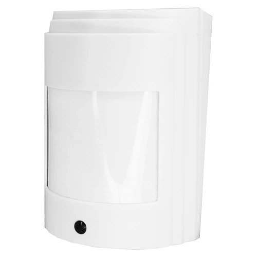 Biała, bezprzewodowa czujka ruchu o prostokątnym kształcie z zaokrąglonym frontem, posiada czarny sensor na dole. Urządzenie jest przeznaczone do montażu na ścianie i służy do wykrywania ruchu.