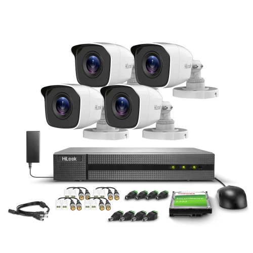 Zestaw monitoringu Hikvision HiWatch składa się z czterech kamer, rejestratora, zasilacza oraz akcesoriów montażowych. Na zdjęciu widoczne są również przewody i dysk twardy Toshiba o pojemności 500 GB.