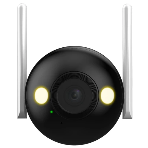 Czarna kamera tubowa z dwoma antenami po bokach i dwoma jasnymi diodami LED na przodzie. Kamera ma centralnie umieszczony obiektyw i jest przeznaczona do monitoringu.