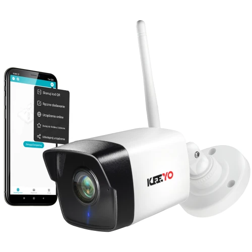 Na zdjęciu znajduje się sieciowa kamera tubowa IP marki KeeYo z anteną do bezprzewodowej komunikacji. Obok kamery widoczny jest smartfon z aplikacją do zarządzania urządzeniem.