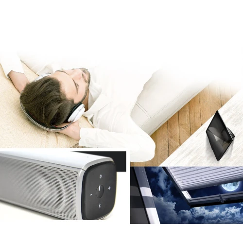 Sterownik gestem Fibaro Swipe to eleganckie, czarne urządzenie, które umożliwia bezdotykowe sterowanie inteligentnym domem. Na zdjęciu jest przedstawiony w nowoczesnym wnętrzu, obok innych urządzeń elektronicznych.