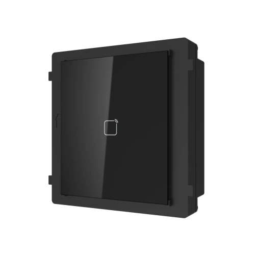 Czarny panel wideodomofonu o minimalistycznym designie z centralnie umieszczonym przyciskiem dotykowym. Urządzenie ma prostokątny kształt i eleganckie wykończenie, idealne do nowoczesnych instalacji domofonowych.